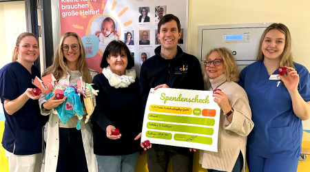 Moki-Mitglieder mit Spendenscheck (Quelle: RTF.3)